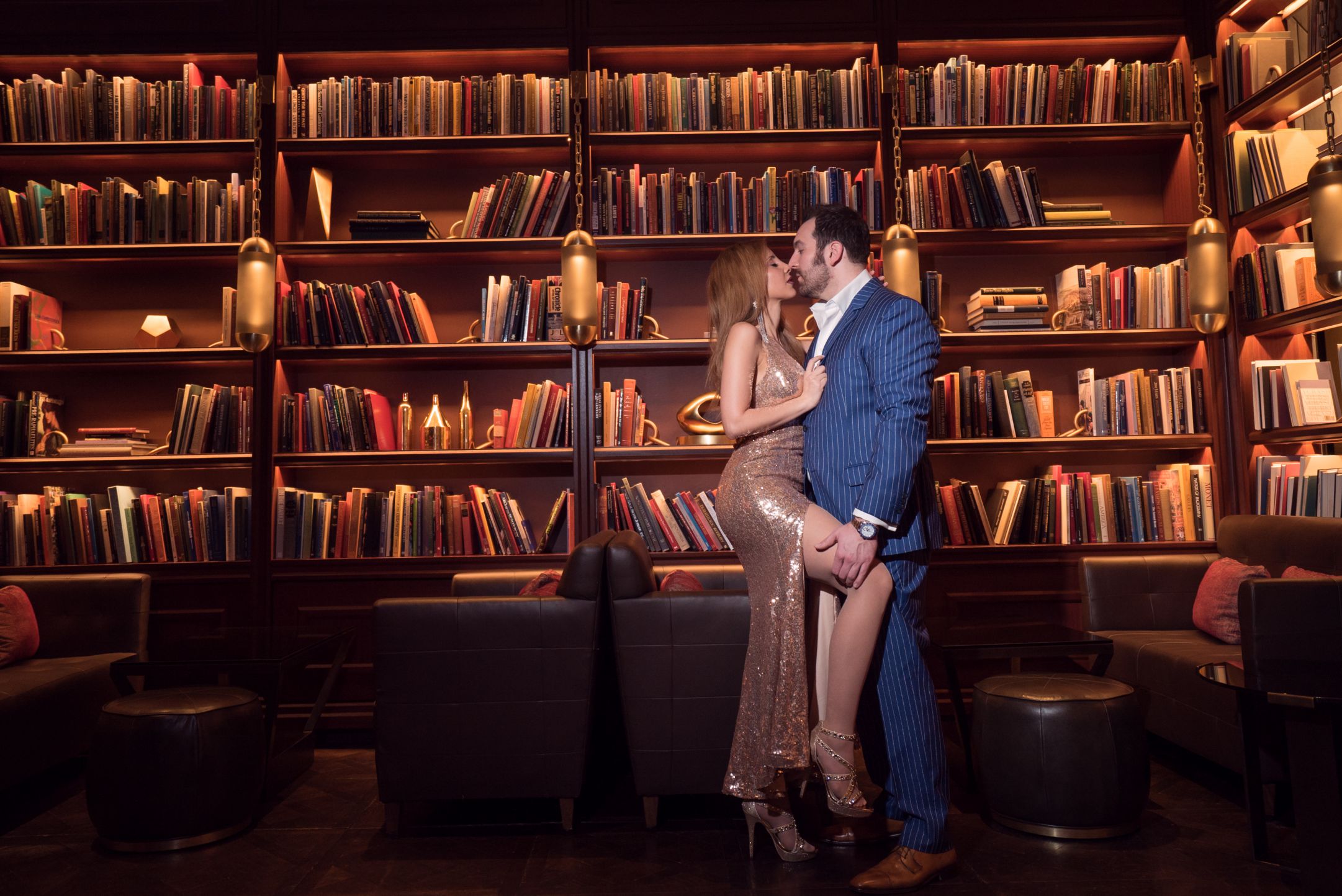 Couple photoshoot inside a library all dressed up