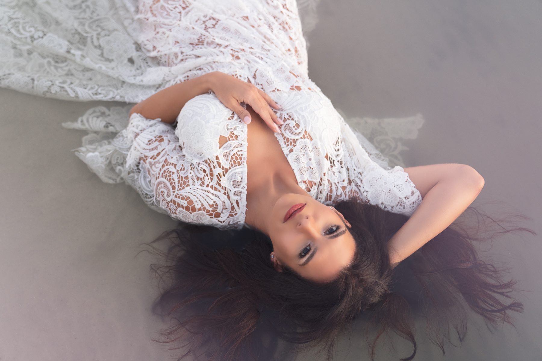 Boudoir photo of girl in white lace dress outdoors 3