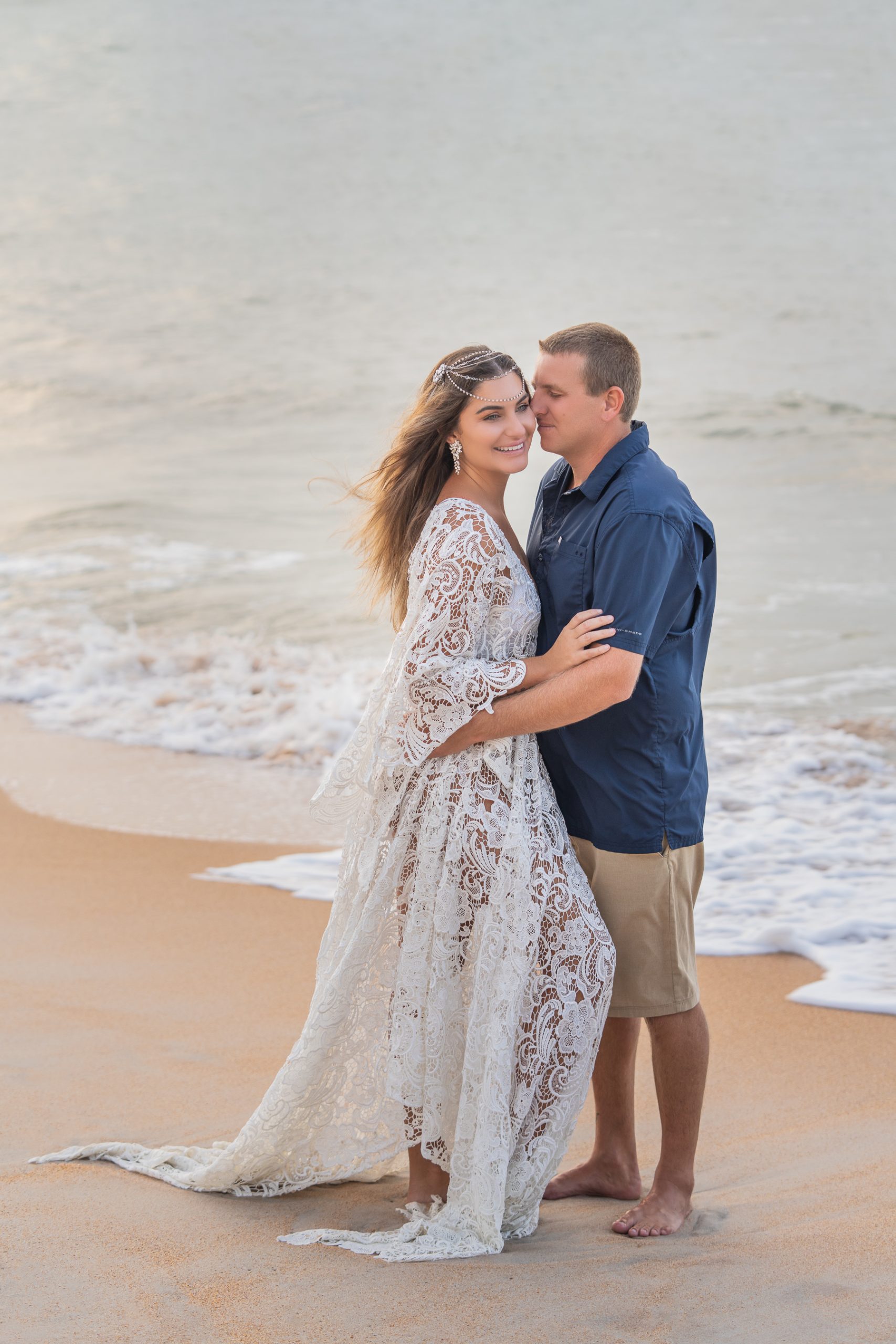 Boudoir photo of girl in white lace dress with husband near sea 4